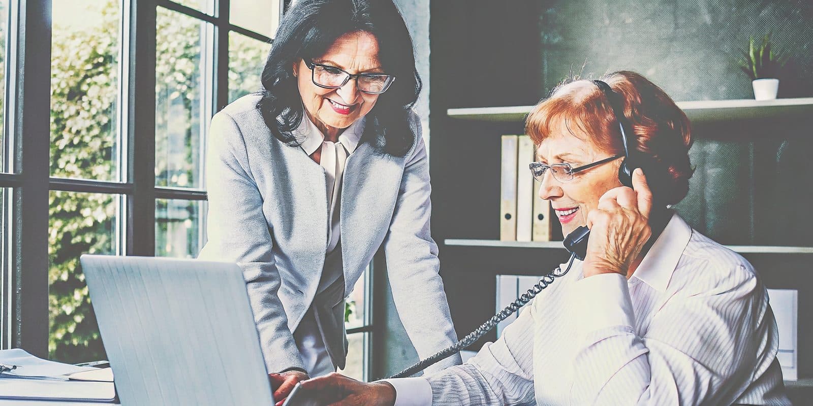 Licensed Medicare advisor wearing a headset, taking a call to review plan options with a client